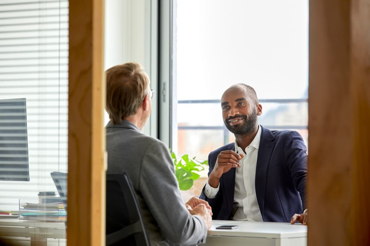 Leadership coach meeting one-on-one with an executive client