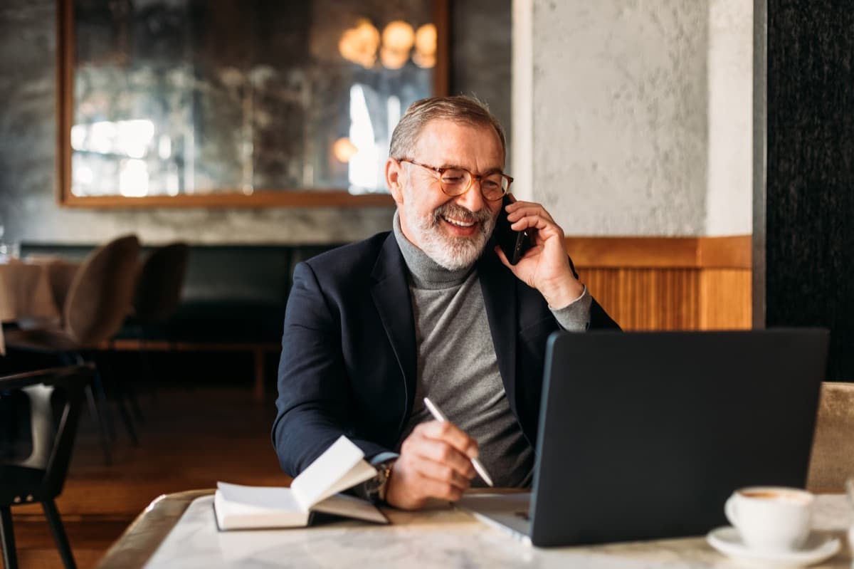 Executive taking a coaching call at his laptop