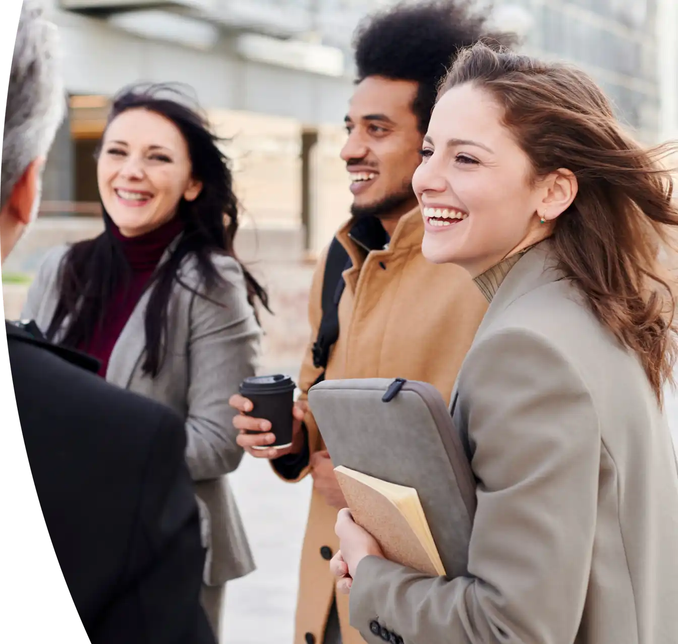 A group of diverse professionals walking together and talking